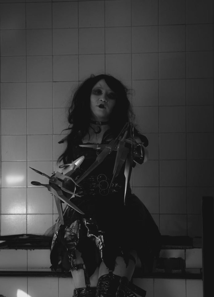 Surreal, unsettling artwork with distorted figures and chaotic horror elements.