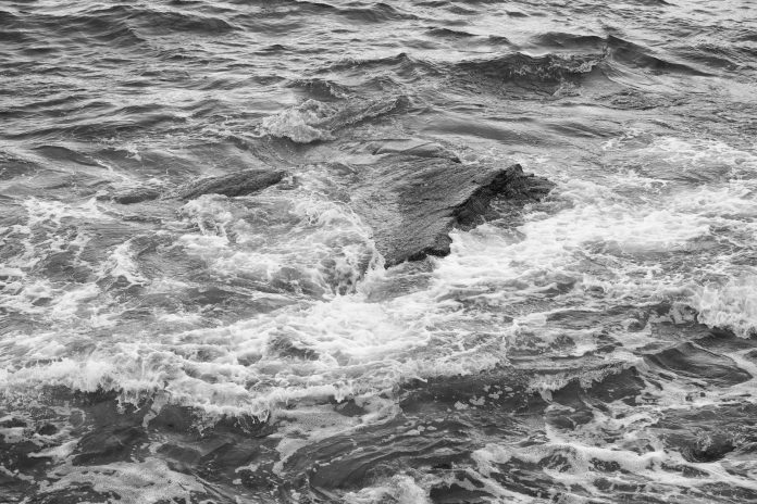 A man and woman in dramatic suspense, close-up.